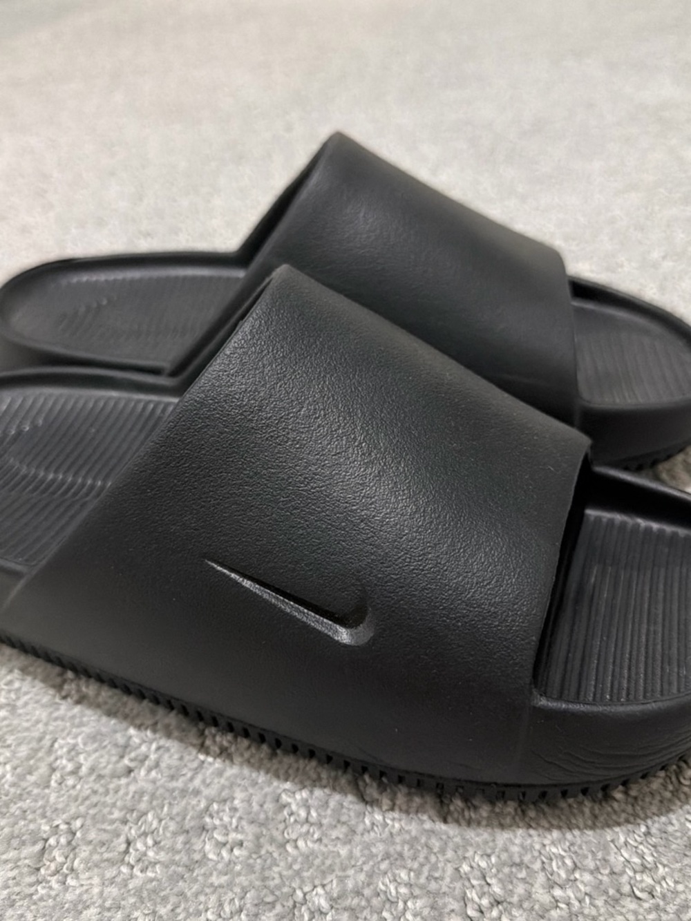 Nike Women’s Black Slide Sandals with Embossed Swoosh